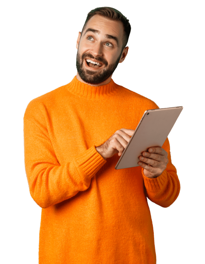 A smiling man in an orange sweater using a tablet, illustrating the digital entry of responses during a sensory analysis session at Techni'Sens.